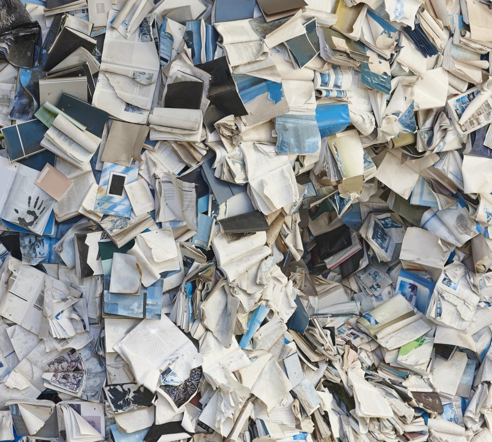 Paper waste, recyclable materials. Sustainable environment. Garbage container